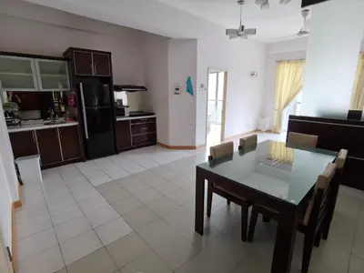 a kitchen and dining room with a table and chairs at Seri Bukit Ceylon By S&S in Kuala Lumpur