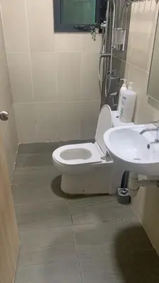 a bathroom with a toilet and a sink at Cozy Stay at Legasi 5 minutes Walking distance to KLCC in Kuala Lumpur