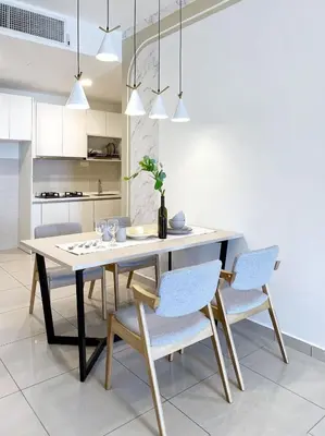 a dining room with a table and chairs at Cozy Stay at Legasi 5 minutes Walking distance to KLCC in Kuala Lumpur