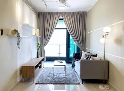 a living room with a couch and a table at Cozy Stay at Legasi 5 minutes Walking distance to KLCC in Kuala Lumpur