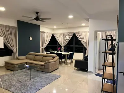 a living room with a couch and a table at Sweethome in Kuala Lumpur