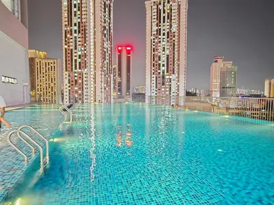 a swimming pool on top of a city skyline at GRAND Suites Chamber AT Klcc in Kuala Lumpur