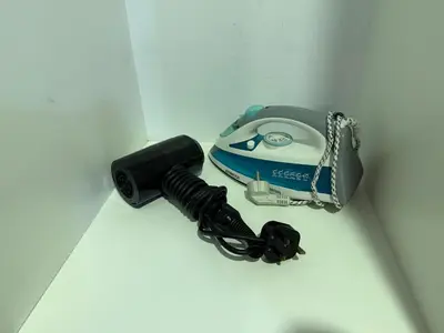 a camera and a flashlight on a white wall at Votrex Suites KLCC By Classic Home in Kuala Lumpur