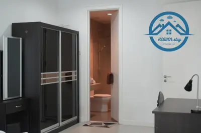 a bathroom with a toilet and a sign on the wall at Binjai 8 Premium Soho by Heaven Stay in Kuala Lumpur