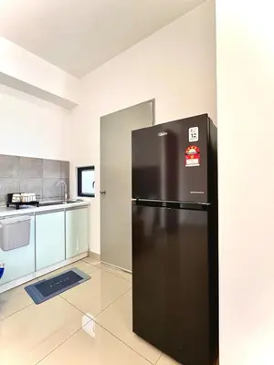 a kitchen with a black refrigerator in a room at Kuala Lumpur, Sunway Velocity, M Vertica, 8-10Pax in Kuala Lumpur