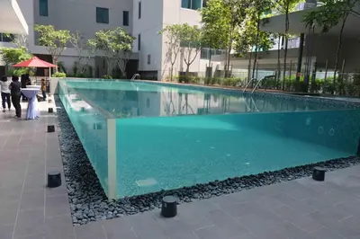 a swimming pool in the middle of a building at Summer Suites Studios in Kuala Lumpur