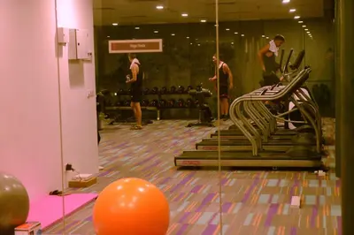 a group of people in a gym with a mirror at Summer Suites Studios in Kuala Lumpur