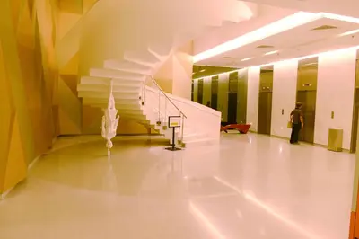 a hallway with a spiral staircase in a building at Summer Suites Studios in Kuala Lumpur