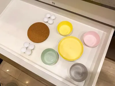 a counter with four different colored bowls on it at TRX Pavilion Top Floor Suite, Kid-Friendly Slide, Dorsett Bukit Bintang KL, Kuala Lumpur Malaysia in Kuala Lumpur