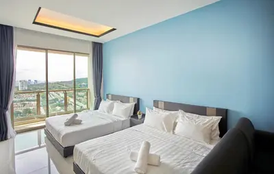 two beds in a room with a large window at Dorsett Residences Sri Hartamas Free Parking by COBNB Mont Kiara Kuala Lumpur in Kuala Lumpur