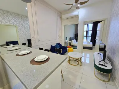 a living room with a dining table and a living room at RuangWaktu at Arte Mont Kiara in Kuala Lumpur