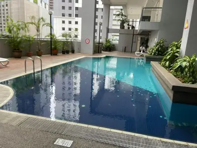 a large swimming pool in the middle of a building at Sky suite at Seri Bukit Ceylon in Kuala Lumpur