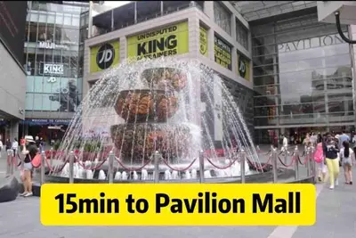 a water fountain in the middle of a building at Infinity Pool 7pax City Homestay KL Mrt Velo TRX in Kuala Lumpur