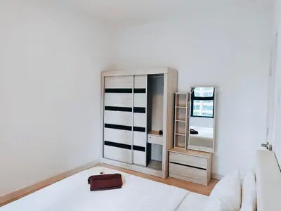 a living room with a white couch and a mirror at Arte Plus by Stay Relax in Kuala Lumpur