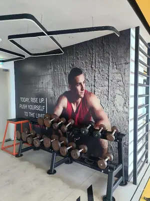 a wall with a bunch of dumbbells on it at Arte Plus by Stay Relax in Kuala Lumpur