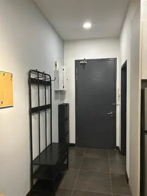 a black door in a room with a tile floor at V Residence Suites, Sunway Velocity by Rasbo Galaxy Suites in Kuala Lumpur