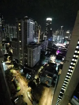 a view of a city at night with buildings at Seri Bukit Ceylon apartment in Kuala Lumpur