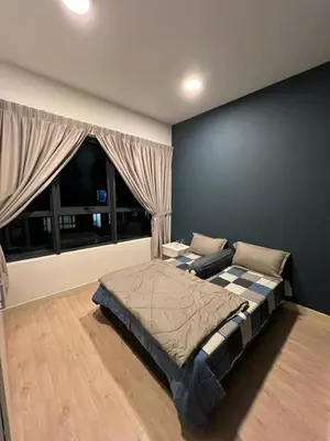 a bedroom with a large bed and a window at Jom Relax in Kuala Lumpur