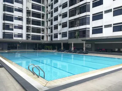 a large swimming pool in front of a building at Fahrenheit88Newly renovated 2mins Pavilion KL KLCC view in Kuala Lumpur