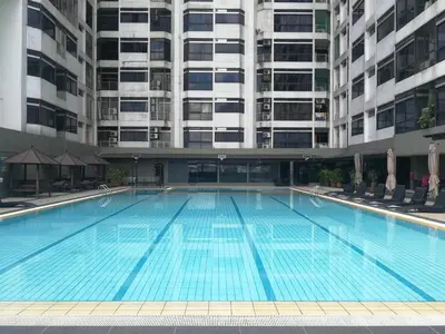 a large swimming pool in front of a building at Fahrenheit88Newly renovated 2mins Pavilion KL KLCC view in Kuala Lumpur