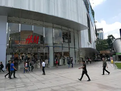 a group of people walking in front of a building at Fahrenheit88Newly renovated 2mins Pavilion KL KLCC view in Kuala Lumpur