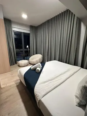 a hotel room with two beds and a window at The Colony By Infinitum With Klcc View in Kuala Lumpur