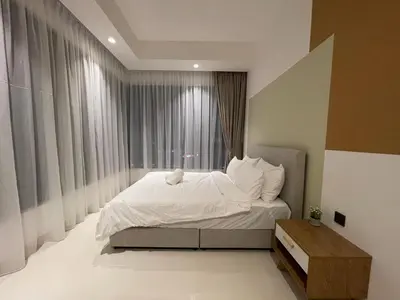 a bedroom with a white bed with a window at Novo Suites Kuala Lumpur by Nestaway Jalan Ampang in Kuala Lumpur