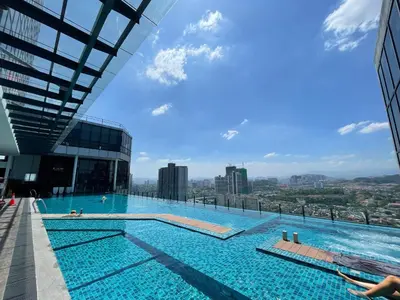 a swimming pool on top of a building at Novo Suites Kuala Lumpur by Nestaway Jalan Ampang in Kuala Lumpur