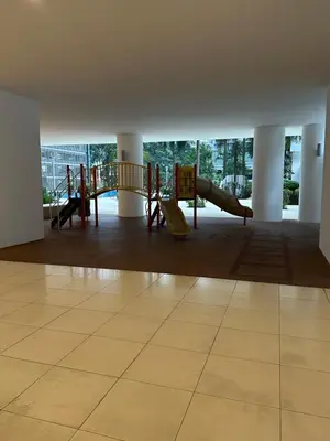 a room with a playground with a slide at KLCC Marc Residence by AZ Line in Kuala Lumpur