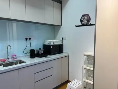 a kitchen with a sink and a microwave at The Colony By Infinitum KLCC - Aura Suites in Kuala Lumpur