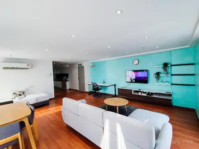 a living room with a white couch and a tv at Arina Uniti Kampung Baru HKL - Idealhub in Kuala Lumpur