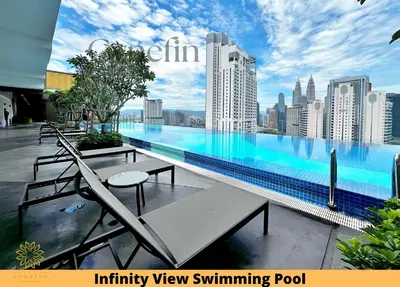 a swimming pool with a view of a city at Majestic Residence Kuala Lumpur near Bukit Bintang & Chow Kit in Kuala Lumpur