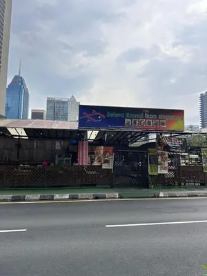 a store on the side of a street with a sign at The Colony By Infinitum With Rooftop Pool in Kuala Lumpur