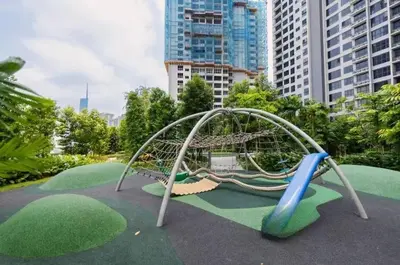 a playground in a park with a slide at TRX Agile Bukit Bintang Cozy 2 Bedroom and 1 Living Room Suites in Kuala Lumpur