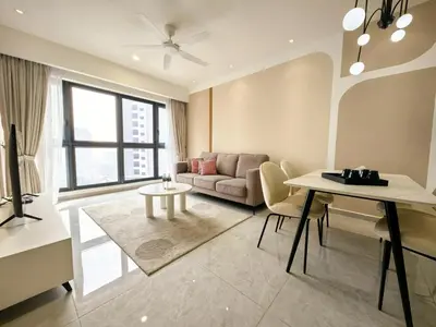 a living room with a couch and a table at TRX Agile Bukit Bintang Cozy 2 Bedroom and 1 Living Room Suites in Kuala Lumpur