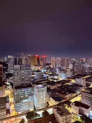 a city skyline at night with illuminated buildings at The Majestic Residence KLCC By Castle in Kuala Lumpur