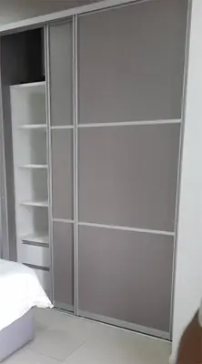 a gray closet with empty shelves in a bedroom at Kuala Lumpur Mont Kiara Arcoris SOHO 5 Pax, Walk to Mall, Pool, WIFI in Kuala Lumpur