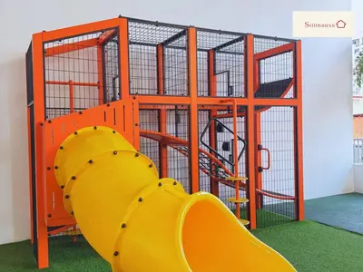a playground with a yellow slide in a room at KLCC View Walk to PWTC & Sunway Putra 3 Pax in Kuala Lumpur