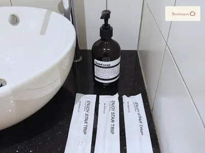 a bottle of alcohol sitting on a counter next to a sink at KLCC View Walk to PWTC & Sunway Putra 3 Pax in Kuala Lumpur