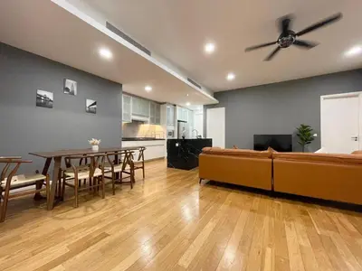 a living room with a couch and a table at St Mary Residence by PILLOWTALKS in Kuala Lumpur