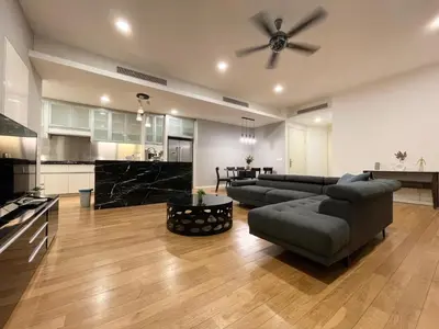 a living room with a couch and a ceiling fan at St Mary Residence by PILLOWTALKS in Kuala Lumpur