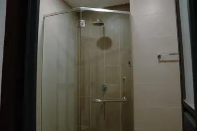 a shower with a glass door in a bathroom at KL Luxury Residence 3BR Golden Triangle in Kuala Lumpur