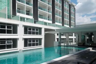 a swimming pool in front of a building at Lux Studio Plaza Damas Kuala Lumpur KL in Kuala Lumpur