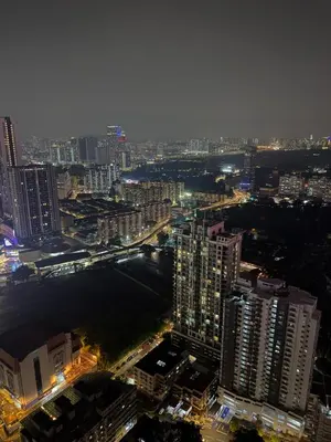 a view of a city at night with buildings at ROBERTSON RESIDENCE KUALA LUMPUR By IKNAS SUITES in Kuala Lumpur