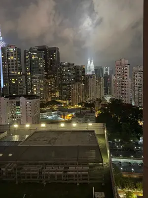 a view of a city at night with buildings at ROBERTSON RESIDENCE KUALA LUMPUR By IKNAS SUITES in Kuala Lumpur