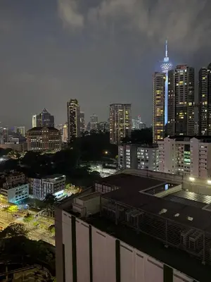 a city skyline at night with tall buildings at ROBERTSON RESIDENCE KUALA LUMPUR By IKNAS SUITES in Kuala Lumpur