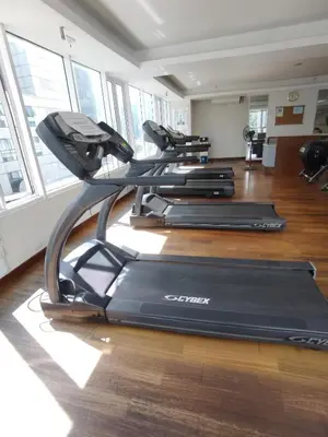 a gym with three exercise bikes in a room at Seri Bukit Ceylon Kuala Lumpur in Kuala Lumpur
