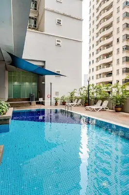 a large blue swimming pool in a building at Seri Bukit Ceylon Kuala Lumpur in Kuala Lumpur