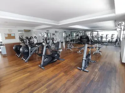a gym with several exercise bikes and treadmills at Seri Bukit Ceylon Kuala Lumpur in Kuala Lumpur