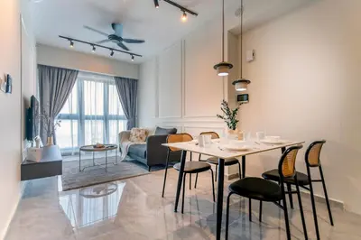 a dining room and living room with a table and chairs at Agile Bukit Bintang TRX KL City by Cobnb in Kuala Lumpur